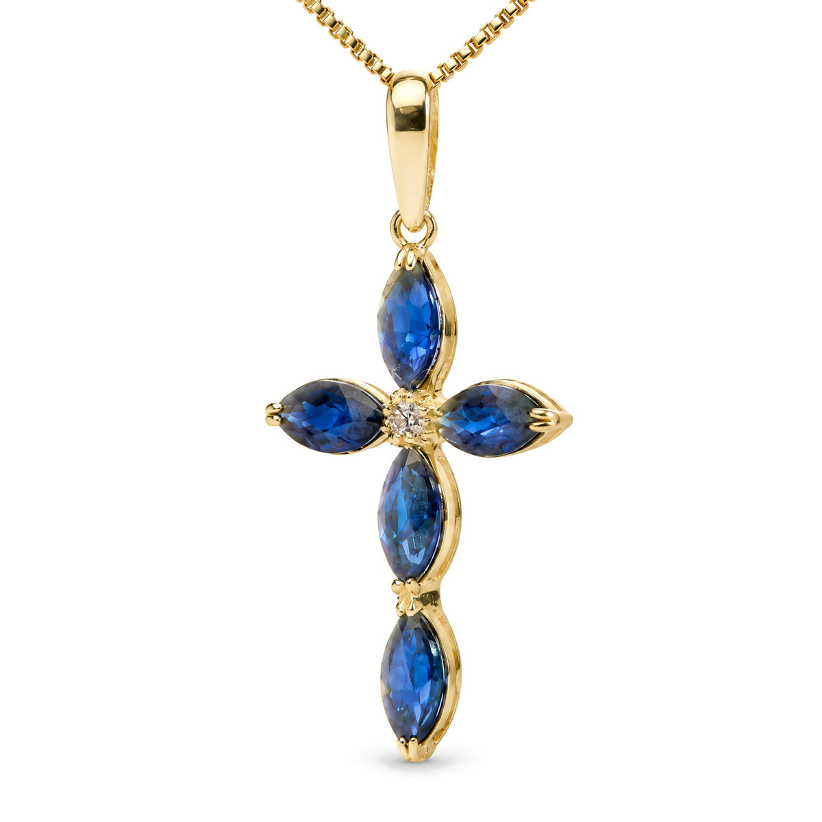 Close-up front view of a yellow metal necklace pendant in the shape of a cross with five blue marquise-shaped gemstones and one round white gemstone in the center.