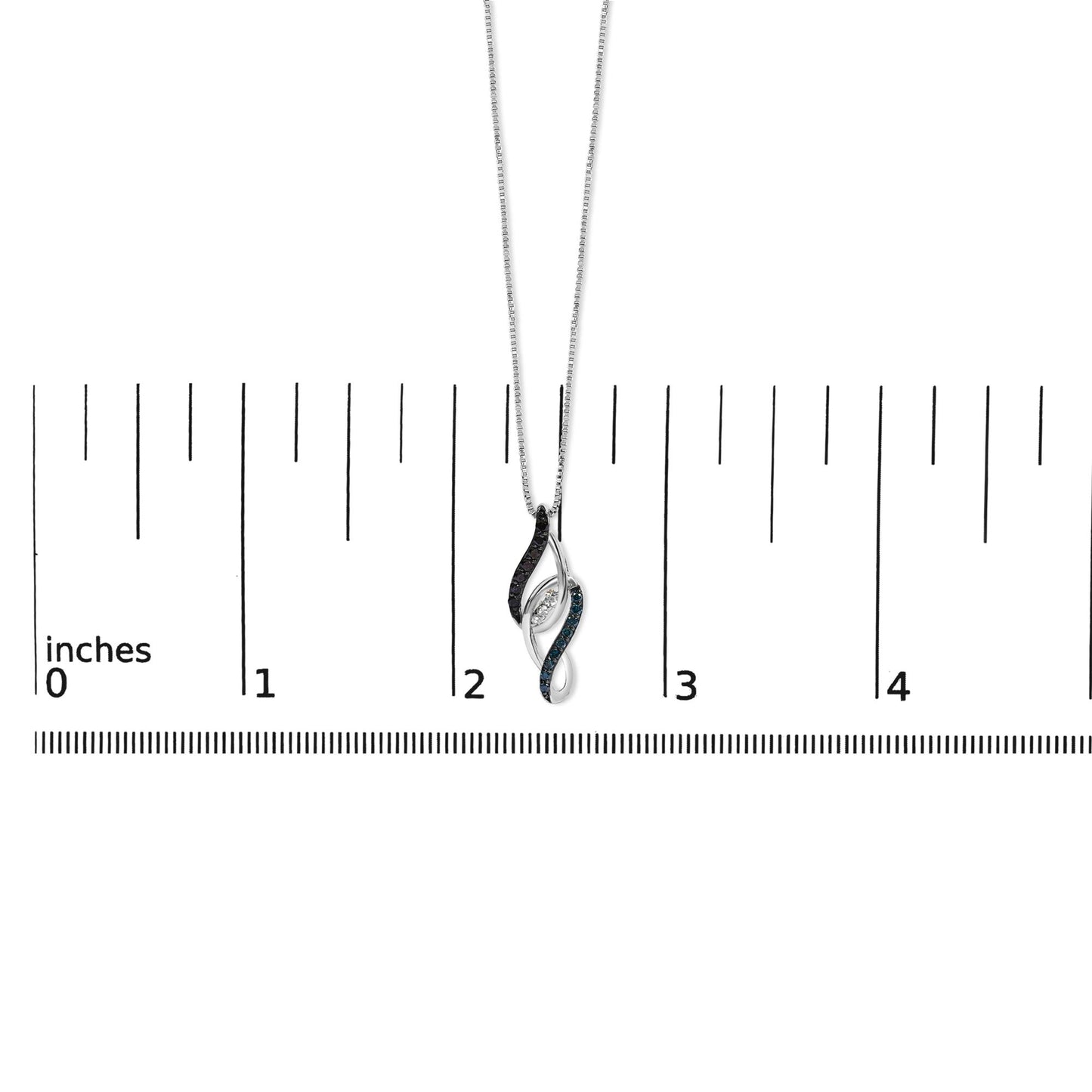 White metal necklace with a pendant shown on a scale. The pendant features an abstract twist design with three white gemstones set in prongs at the center, bordered by rows of blue and black gemstones in shared prong settings. Photo taken from a front angle.