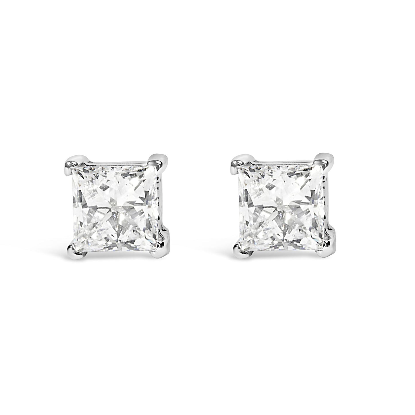 Front angle view of white metal stud earrings with princess shape white gemstones in prong settings.