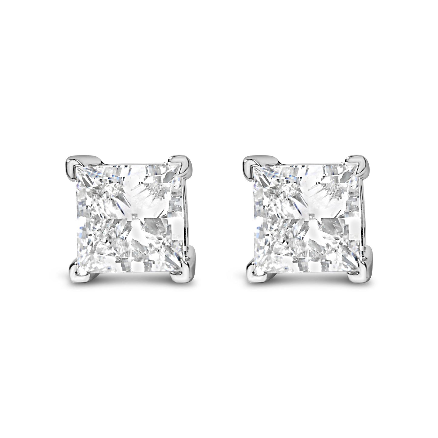 Front angle view of white metal earrings with square-shaped white gemstones in four-prong settings.