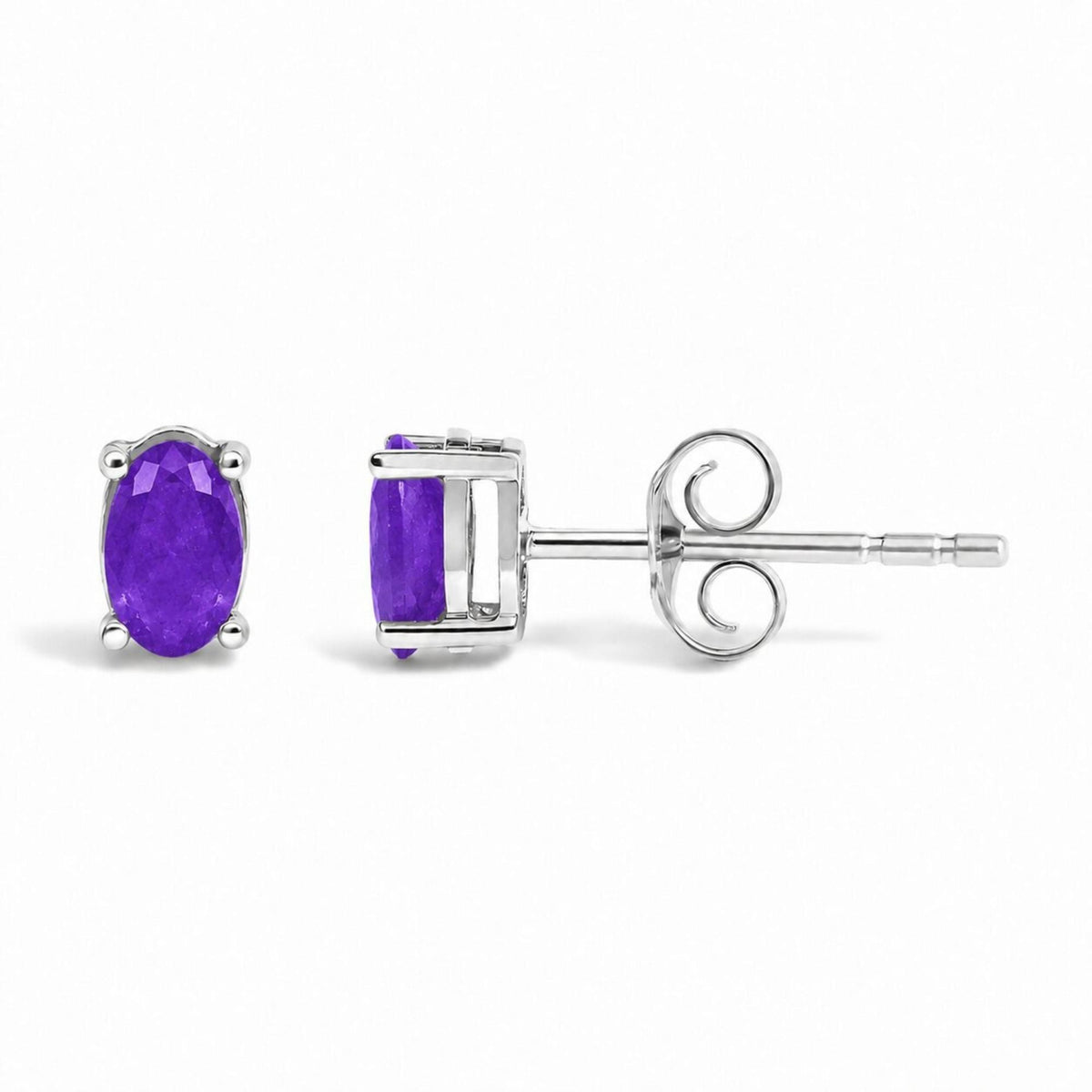 Front and side close-up view of white metal stud earrings featuring an oval purple gemstone set with four prongs, shown on a white background.