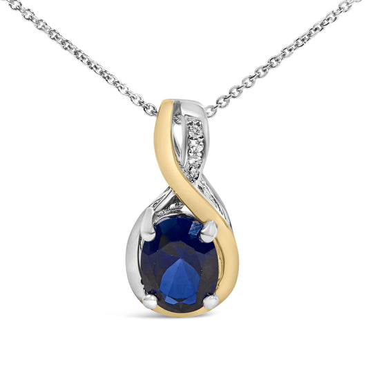 Front view of an 18K yellow gold vermeil blue sapphire pendant necklace showcasing diamond accents on a white background