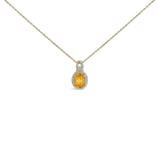 Front view of 14K yellow gold citrine and 1/5 carat diamond pendant necklace showcasing halo setting on white background