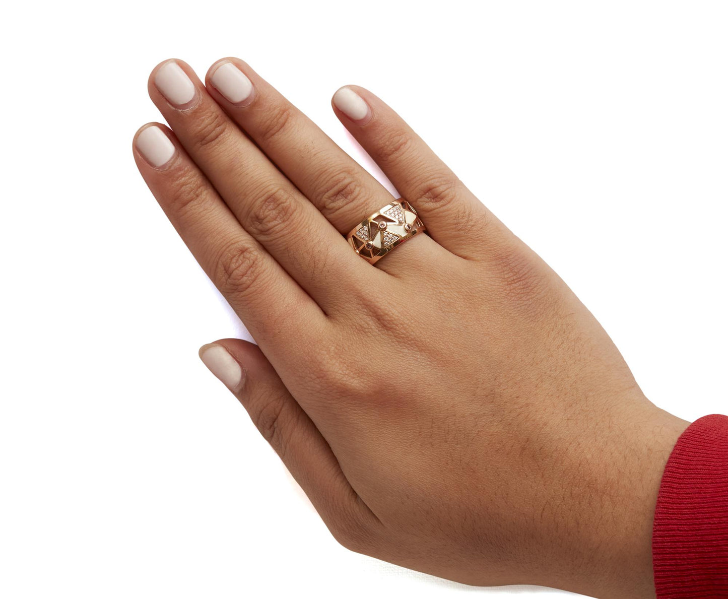 Rose metal ring with white gemstones in pave setting and pink gemstones in bezel setting, shown worn on a model's hand from a top angle.
