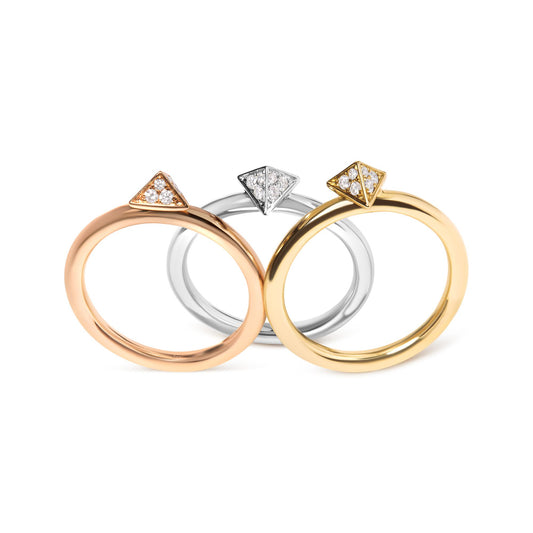 Three rings in yellow, white, and rose metal colors with triangular tops set with white gemstones, shown in a front-facing close-up angle.