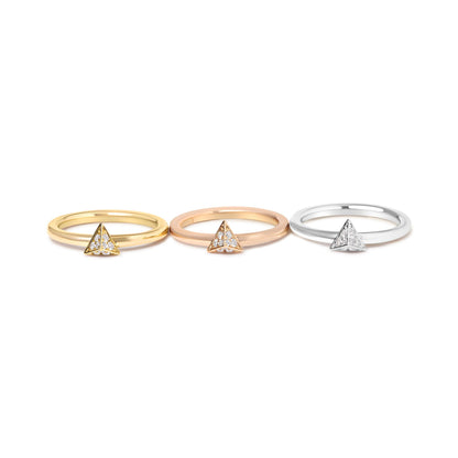 Front view of three rings in yellow, rose, and white metal colors, each featuring a triangular cluster of round white gemstones in pave setting.