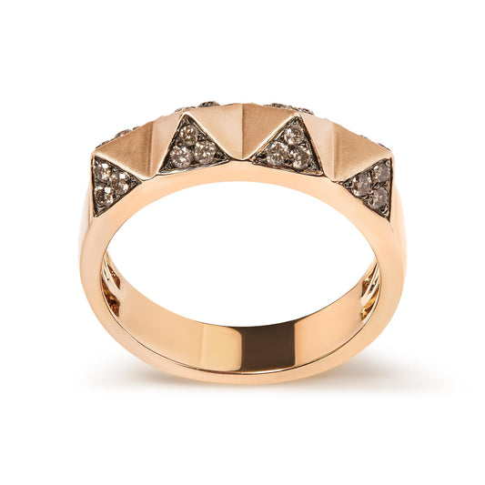 Rose metal ring with pyramid-shaped segments studded with round brown gemstones in a pave setting, shown from a front angle.