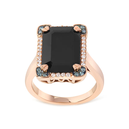 Front-facing view of a rose-colored metal ring featuring a large black rectangular gemstone with four prongs, surrounded by white and blue round pave-set gemstones.