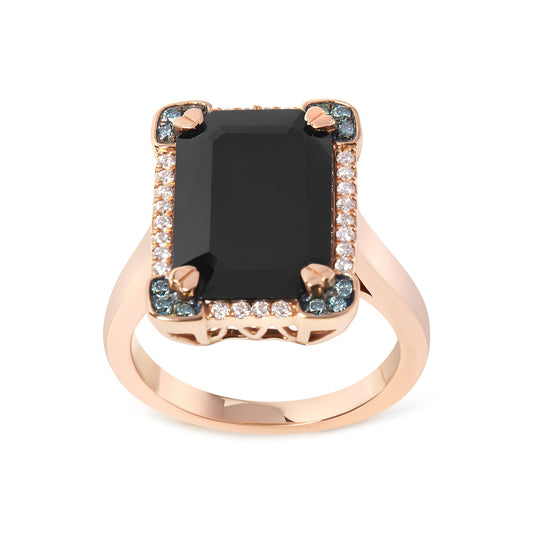 Front-facing view of a rose-colored metal ring featuring a large black rectangular gemstone with four prongs, surrounded by white and blue round pave-set gemstones.