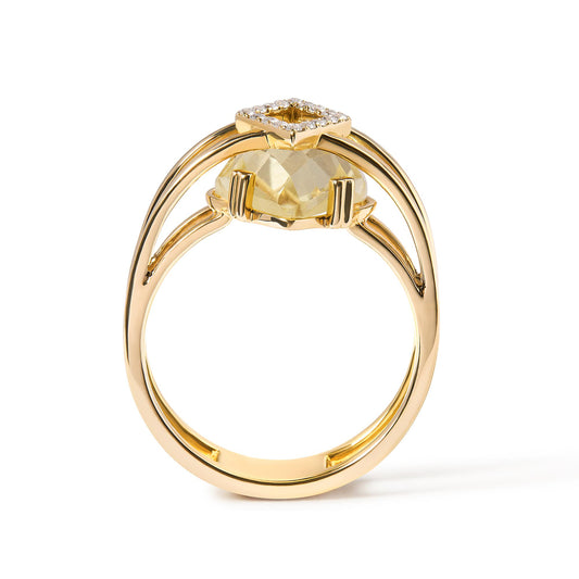 Side view of a yellow metal ring featuring a marquise-shaped yellow gemstone in prong setting and a square cluster of round white gemstones in pave setting on top.
