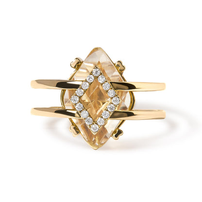 Front view of yellow metal ring with a marquise-shaped yellow gemstone in prong setting surrounded by a diamond-shaped cluster of round white gemstones in pave setting.
