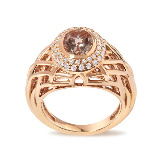 Close-up front angle of a rose-colored metal ring with an oval pink gemstone in a bezel setting, surrounded by round white gemstones in a pave setting, featuring an open lattice design on the band.
