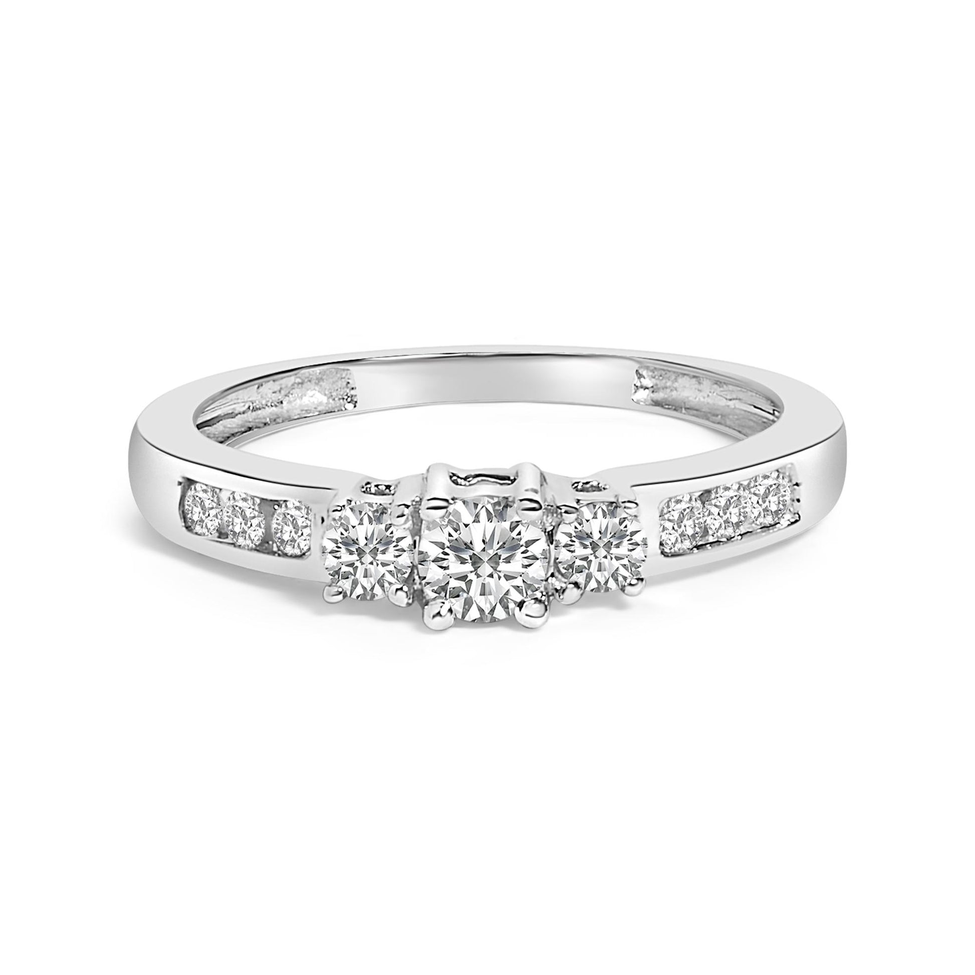 White metal ring with a center round white gemstone in a four-prong setting, flanked by two smaller round white gemstones also in four-prong settings, and additional round white gemstones in channel settings on the band, shown from a front angle on a white background.