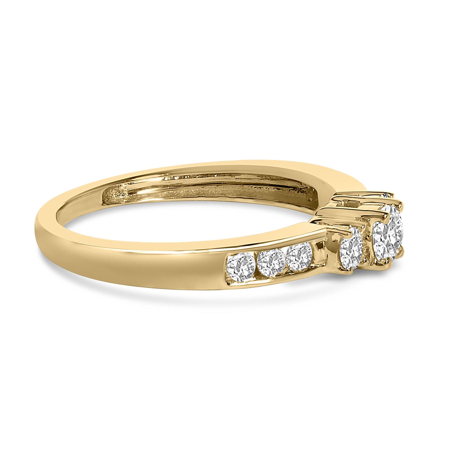 Side angle view of a yellow ring featuring a central round white gemstone held by four prongs, two smaller round white gemstones in four-prong settings on one side, and a row of round white gemstones in a channel setting along the band.