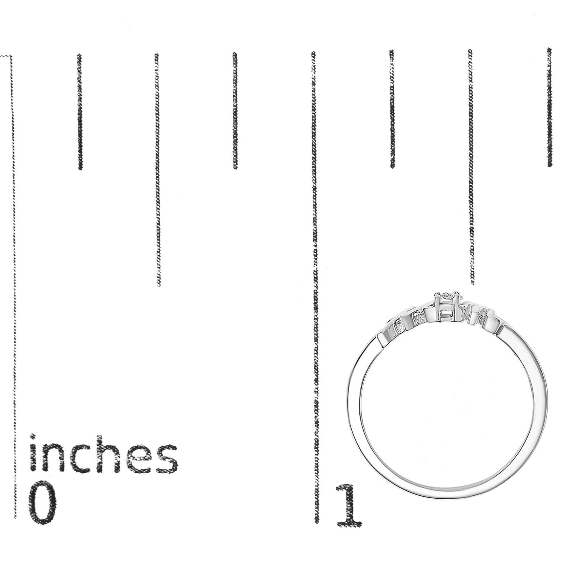 White metal ring with a round white gemstone in prong setting, shown in a side profile on a ruler for size reference.