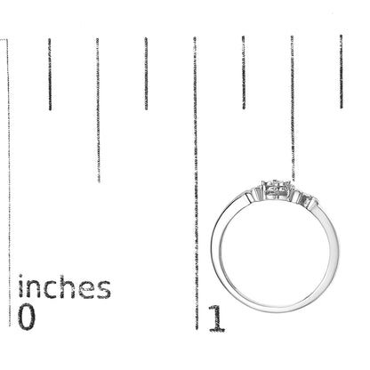 White metal ring with four round white gemstones in prong settings, shown from the side on a ruler for size reference.