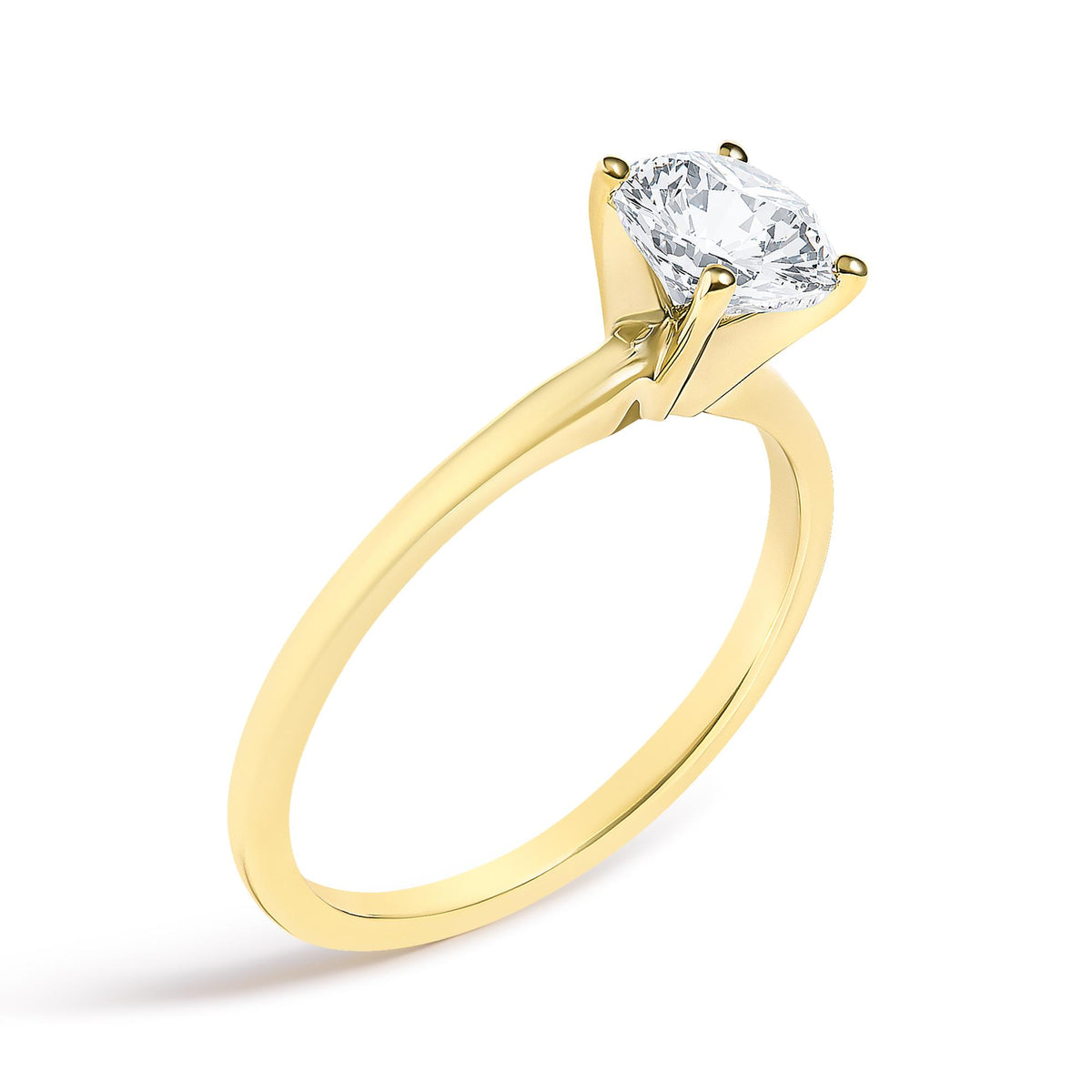 Close-up angled view of a yellow metal ring featuring a single round white gemstone in a four-prong setting.