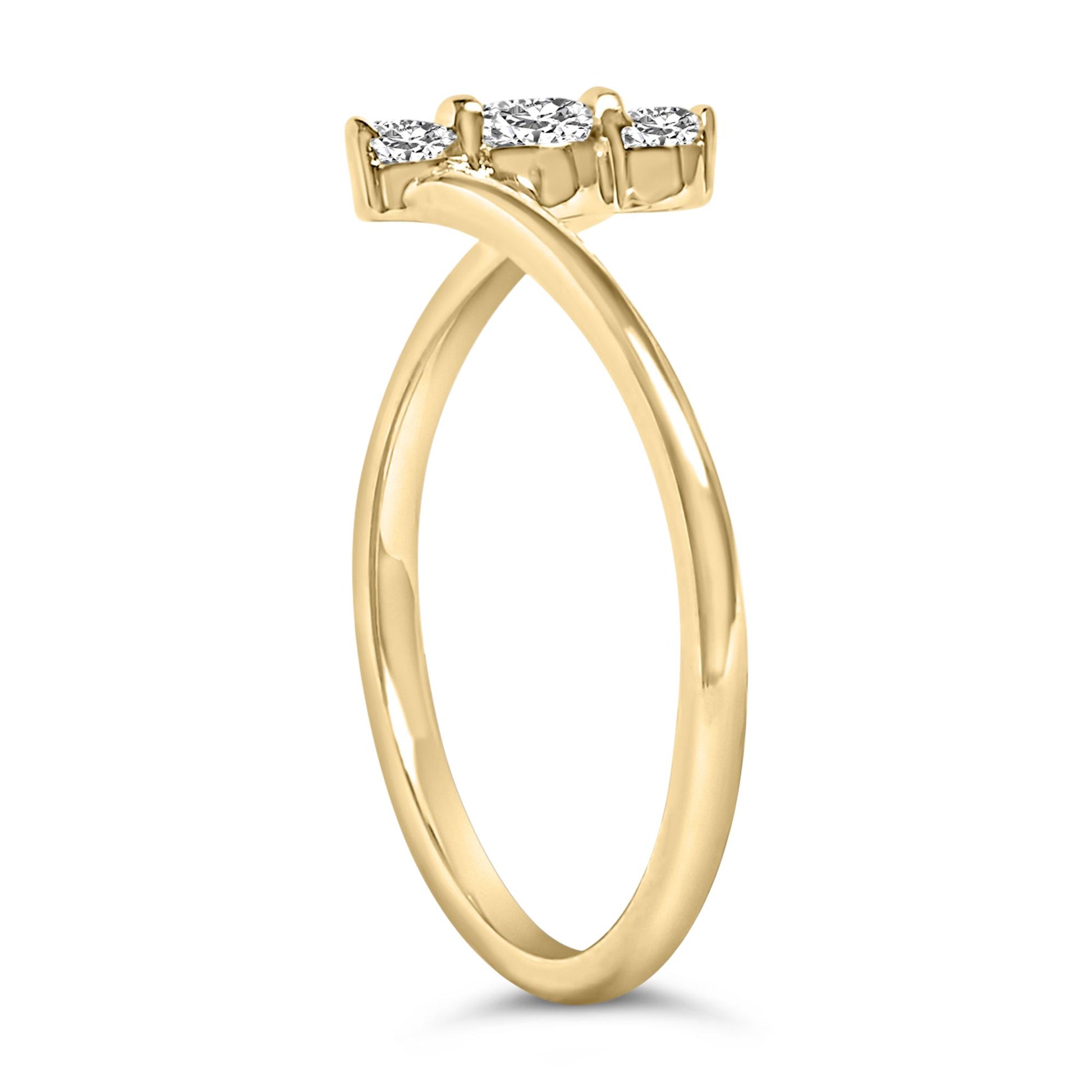 Side view of a yellow ring featuring three white round gemstones in shared prong settings.