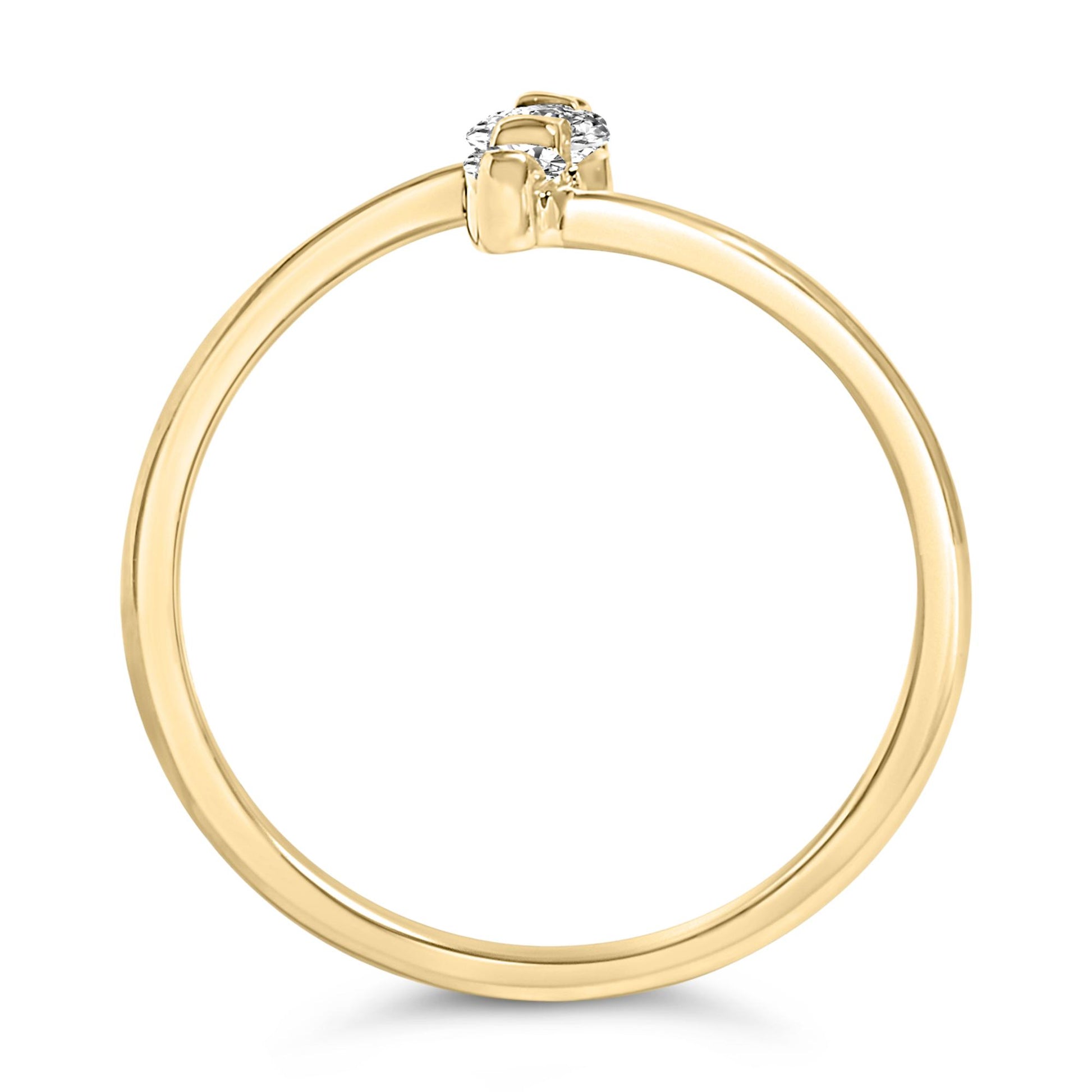 Side view of a yellow metal ring featuring one round white gemstone in a shared prong setting, shown on a white background.