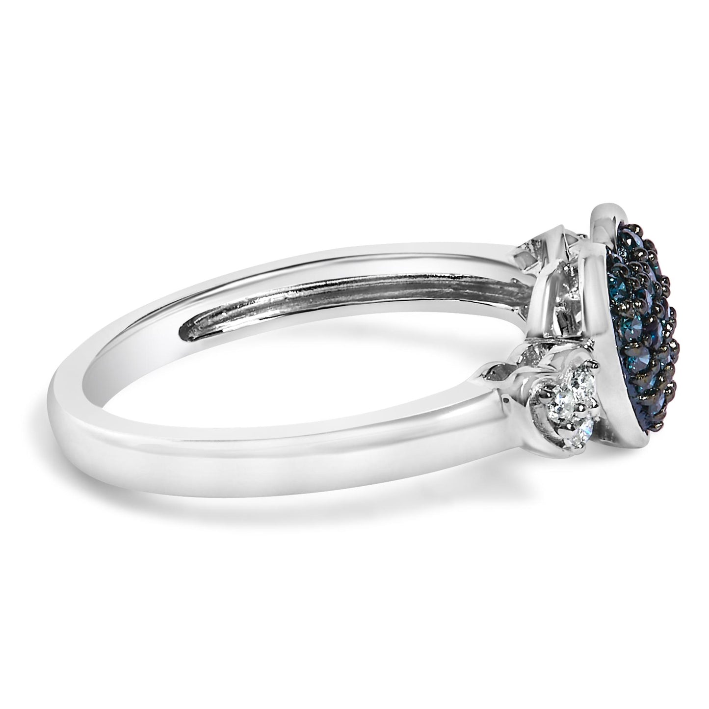 Side close-up view of a white metal ring featuring a cluster of round blue gemstones set in prongs at the center, flanked by smaller round white gemstones in prong settings.