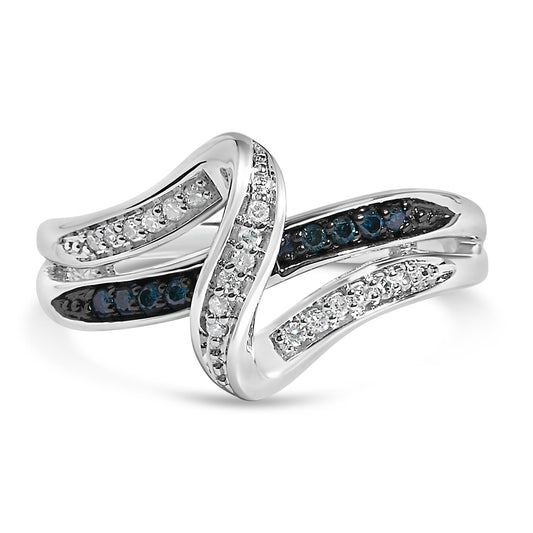 Close-up front angle of a white metal ring with an intertwined design, featuring prong-set round white gemstones and blue gemstones.