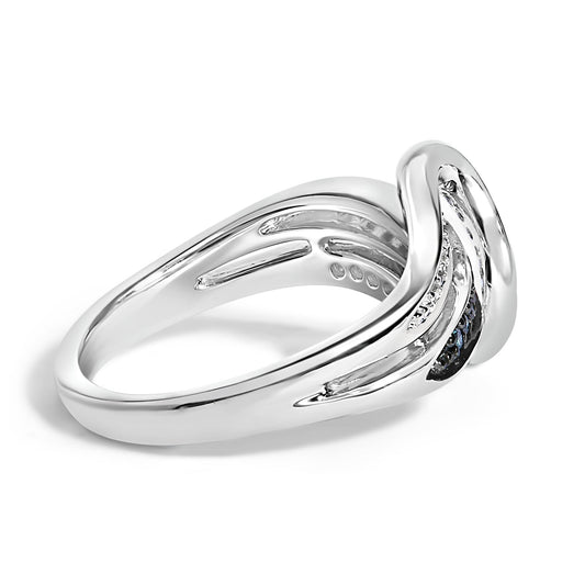 Close-up, angled view of a white metal ring featuring curved bands set with round blue and white gemstones in prong settings.