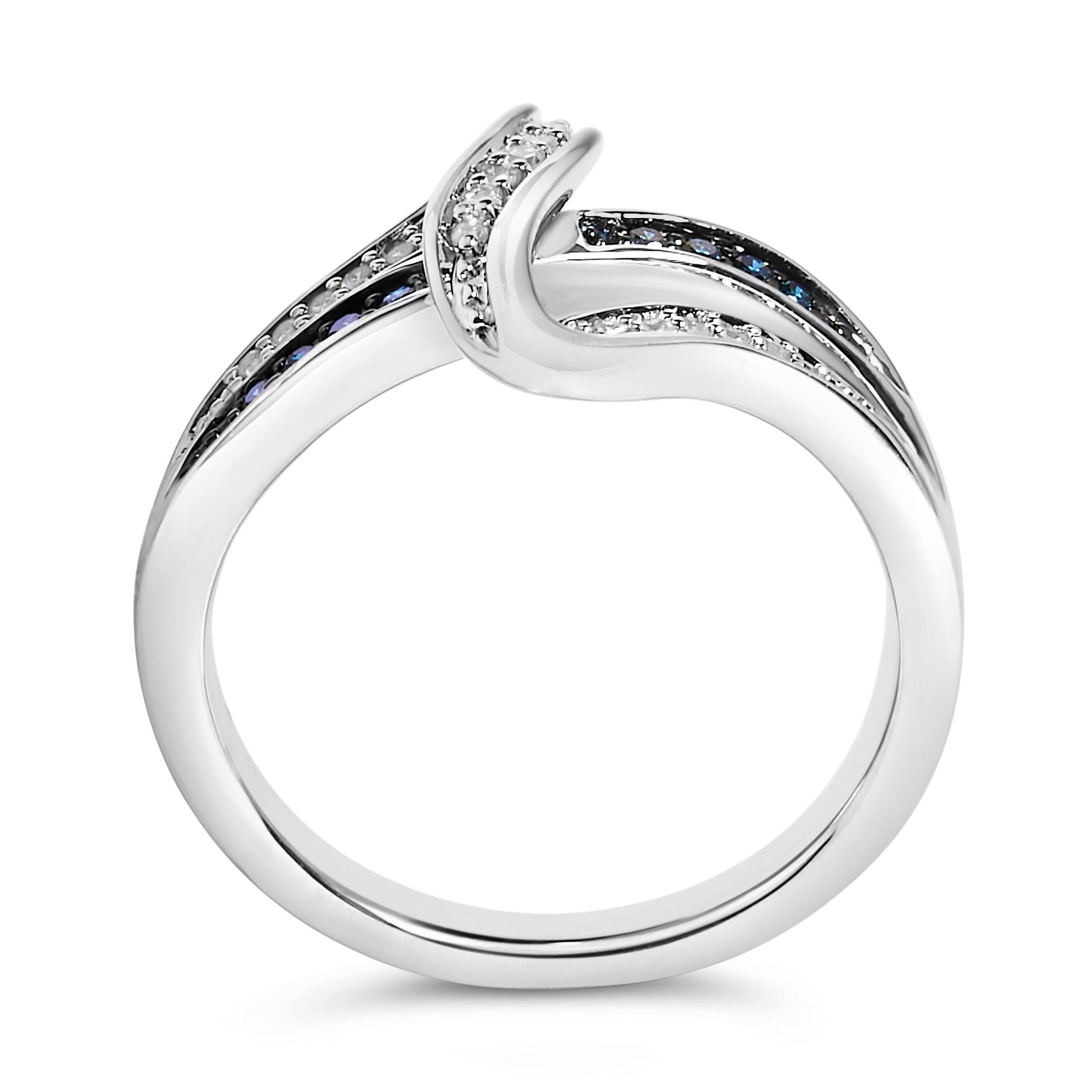Close-up front view of a white metal ring with an elegant curved design, featuring round blue and white gemstones in prong settings along the band.