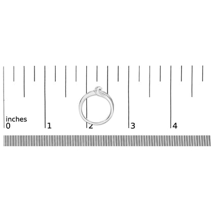 White metal ring with an abstract knot design accented with round blue and white gemstones in prong settings, shown on a ruler scale from a top-down view.