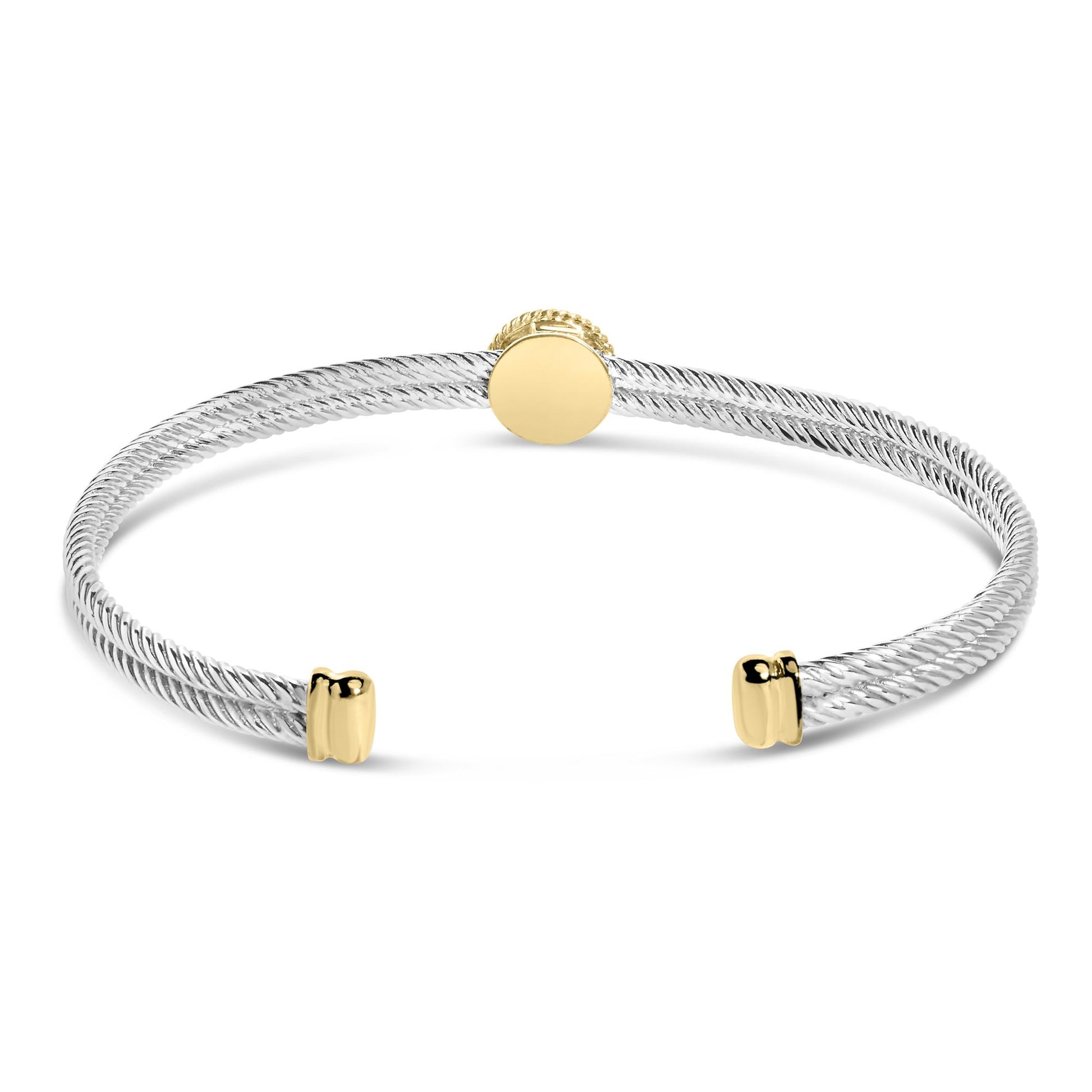 Bracelet with twisted white metal band and yellow metal accents, shown from front angle.