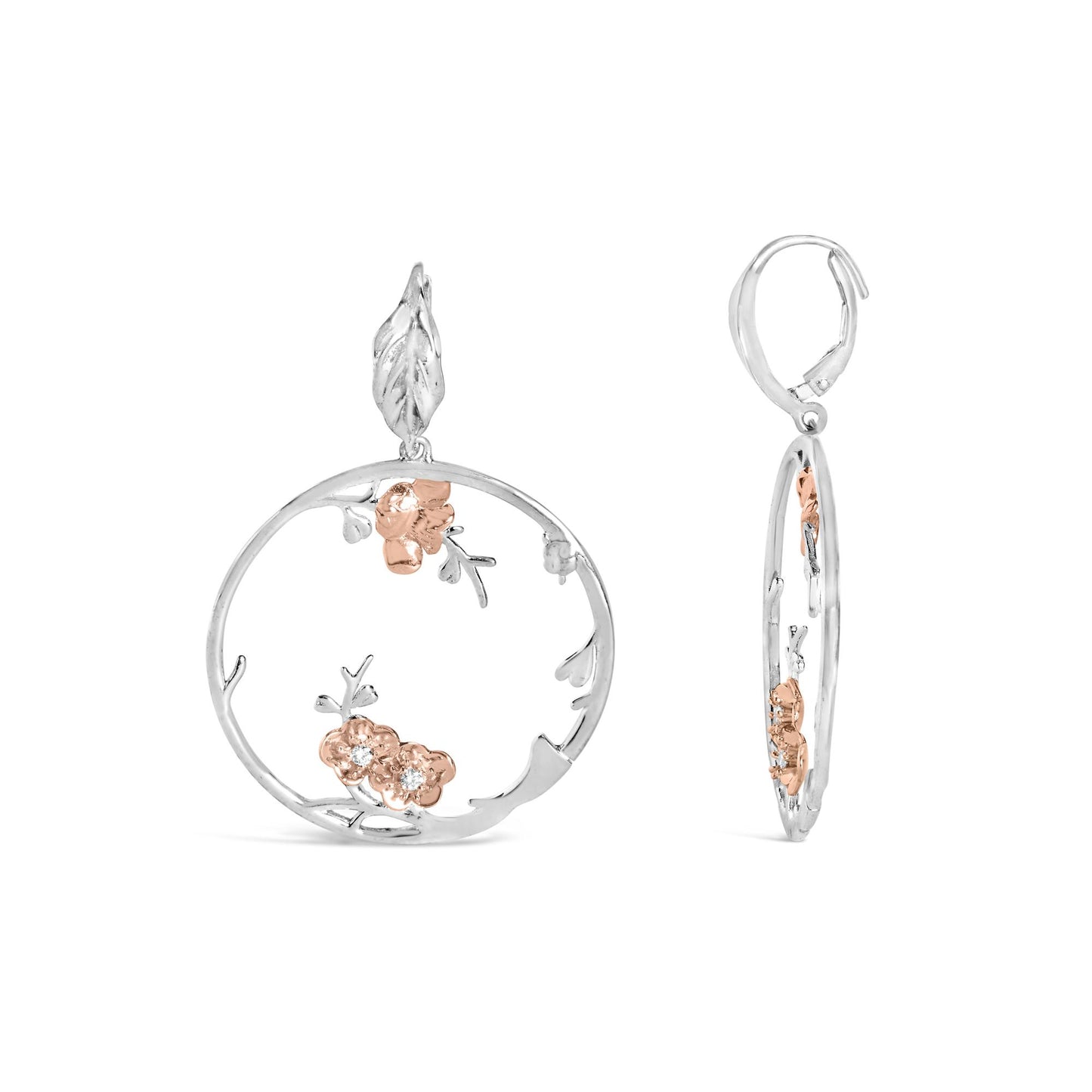 Front and side view of circular earrings with white and rose metal floral design and white round gemstones set in rose metal flowers.