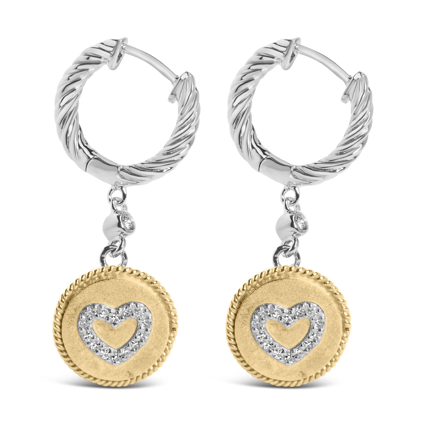 Pair of hoop earrings with twisted white metal design, each featuring a dangling round yellow metal charm with a heart shape outlined by white gemstones, shown from the front.