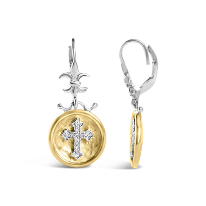 Front and side view of yellow and white metal drop earrings featuring a round medallion with a cross embellished with white gemstones, and a fleur-de-lis design at the top.