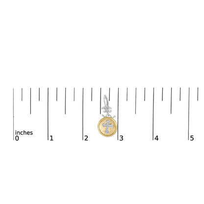 Earring with yellow and white metal featuring a cross design with white gemstones, shown from the front on a ruler for size reference.