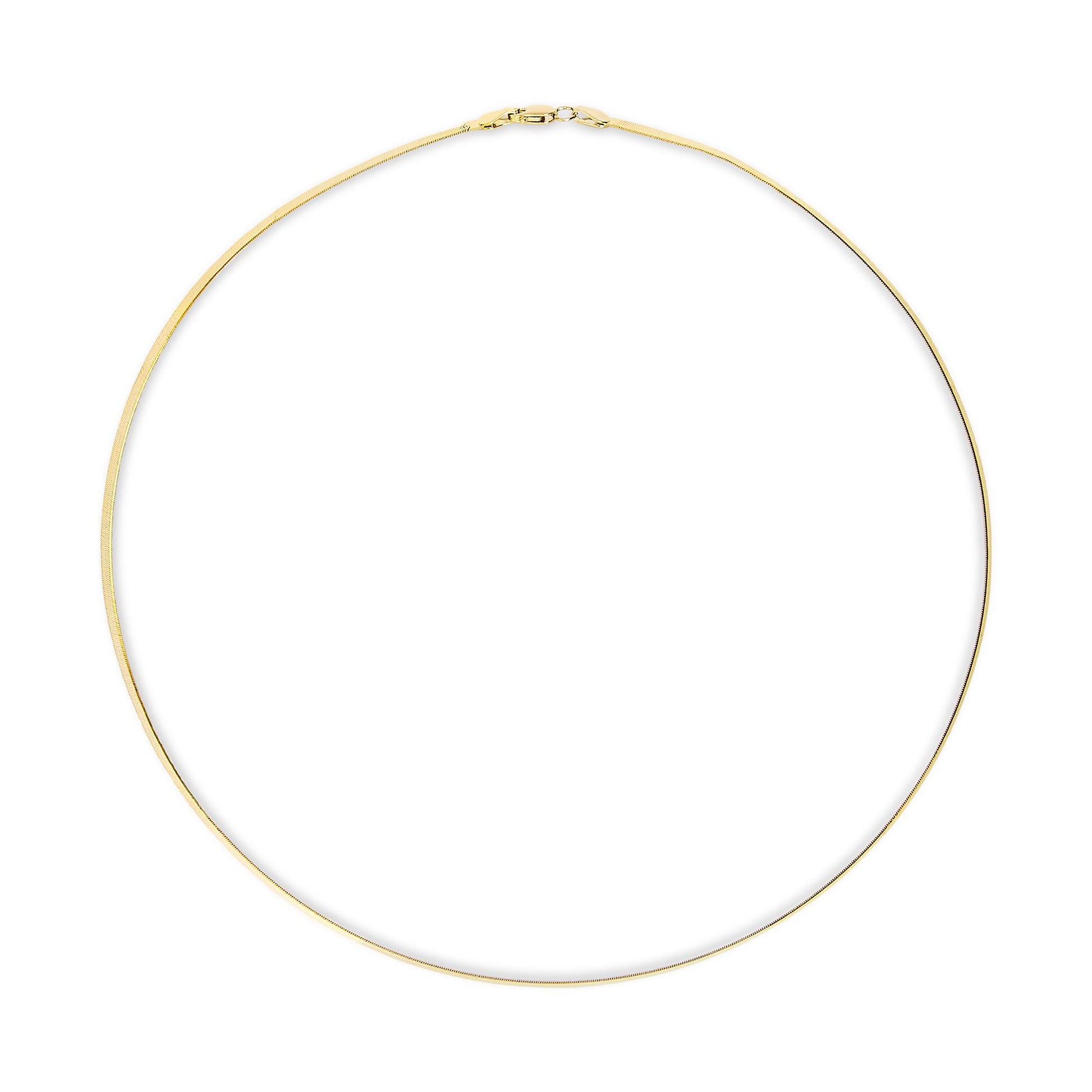 Top-down view of a simple yellow metal chain necklace laid flat in a circle with clasp visible at the top.