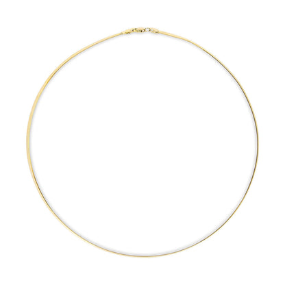Top-down view of a simple yellow metal chain necklace laid flat in a circle with clasp visible at the top.