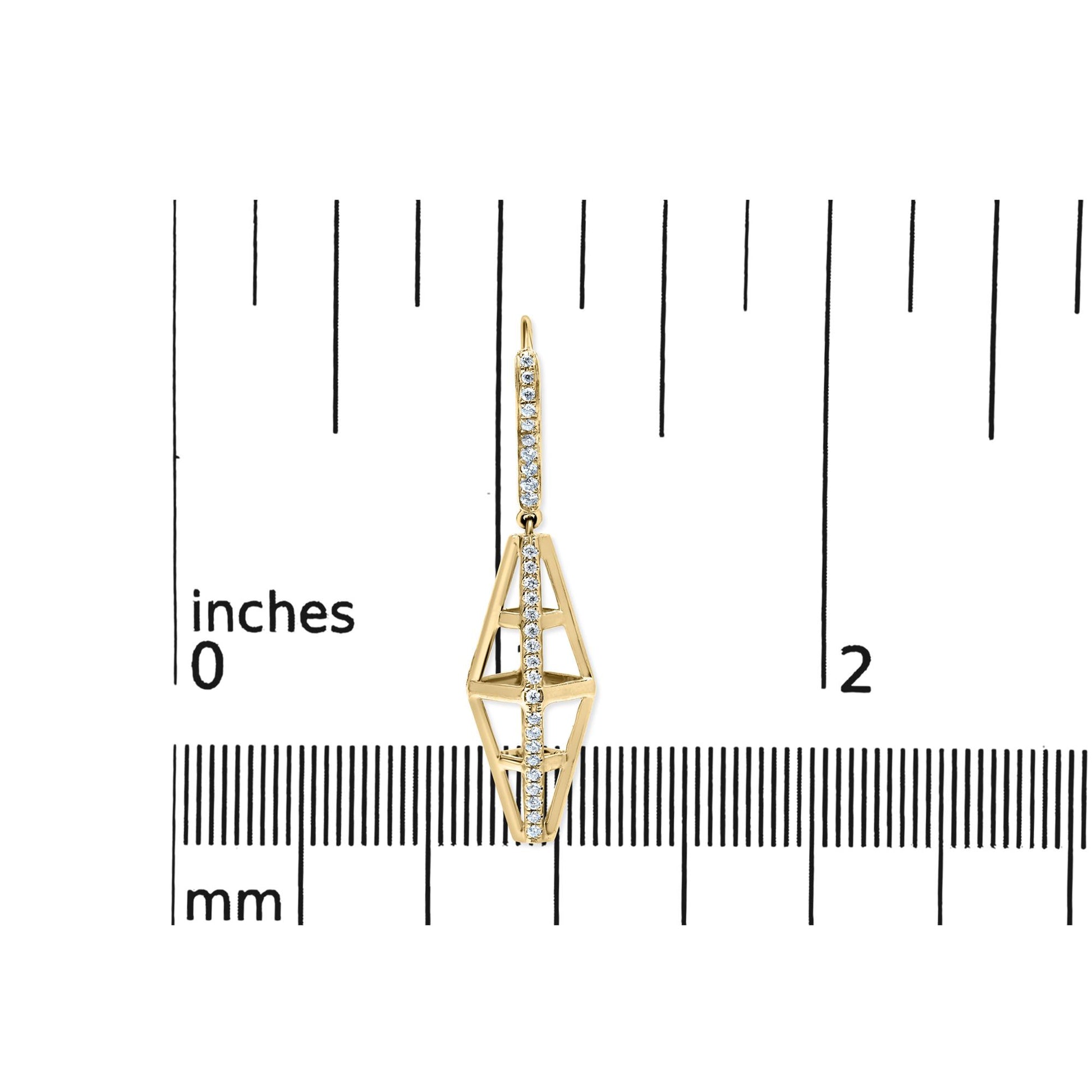 Single yellow metal earring with vertical rows of small white gemstones in a geometric open design, shown from the front on a ruler for size reference.