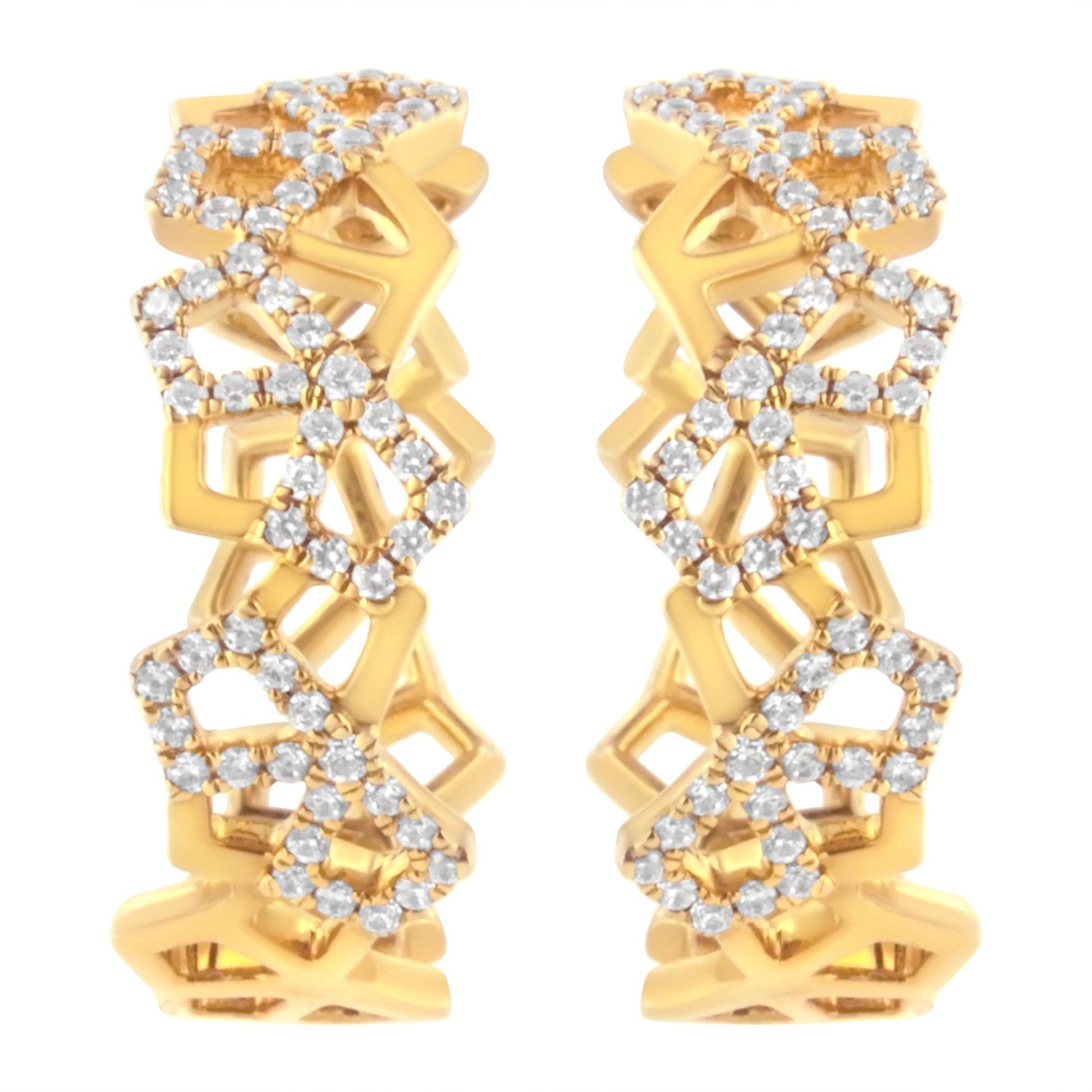 Pair of yellow metal earrings with open geometric design and pave white gemstones, shown from the front angle.