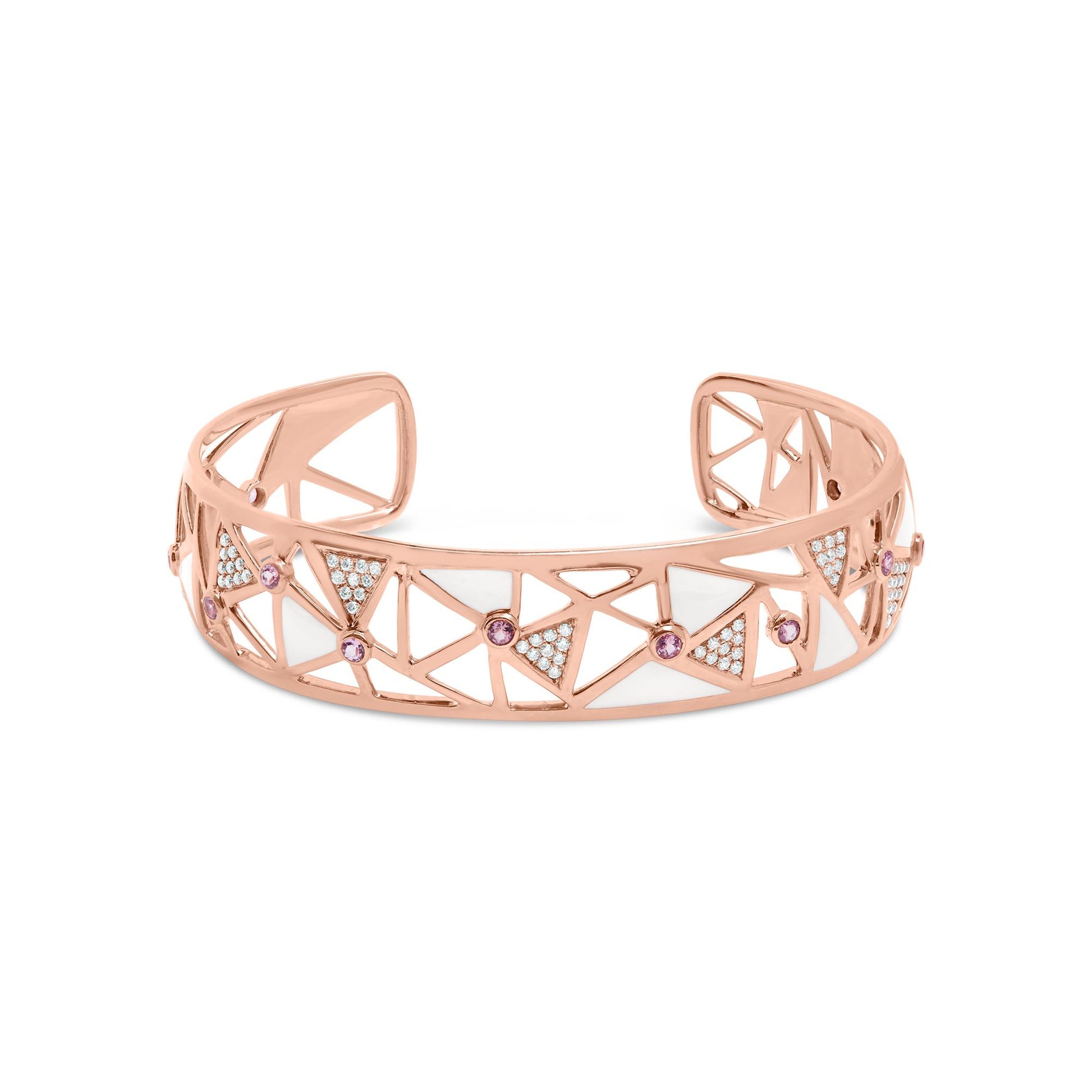 Rose-colored open cuff bracelet with geometric cutouts, white gemstones in pave setting, and pink round gemstones in bezel setting, shown from a front angle.