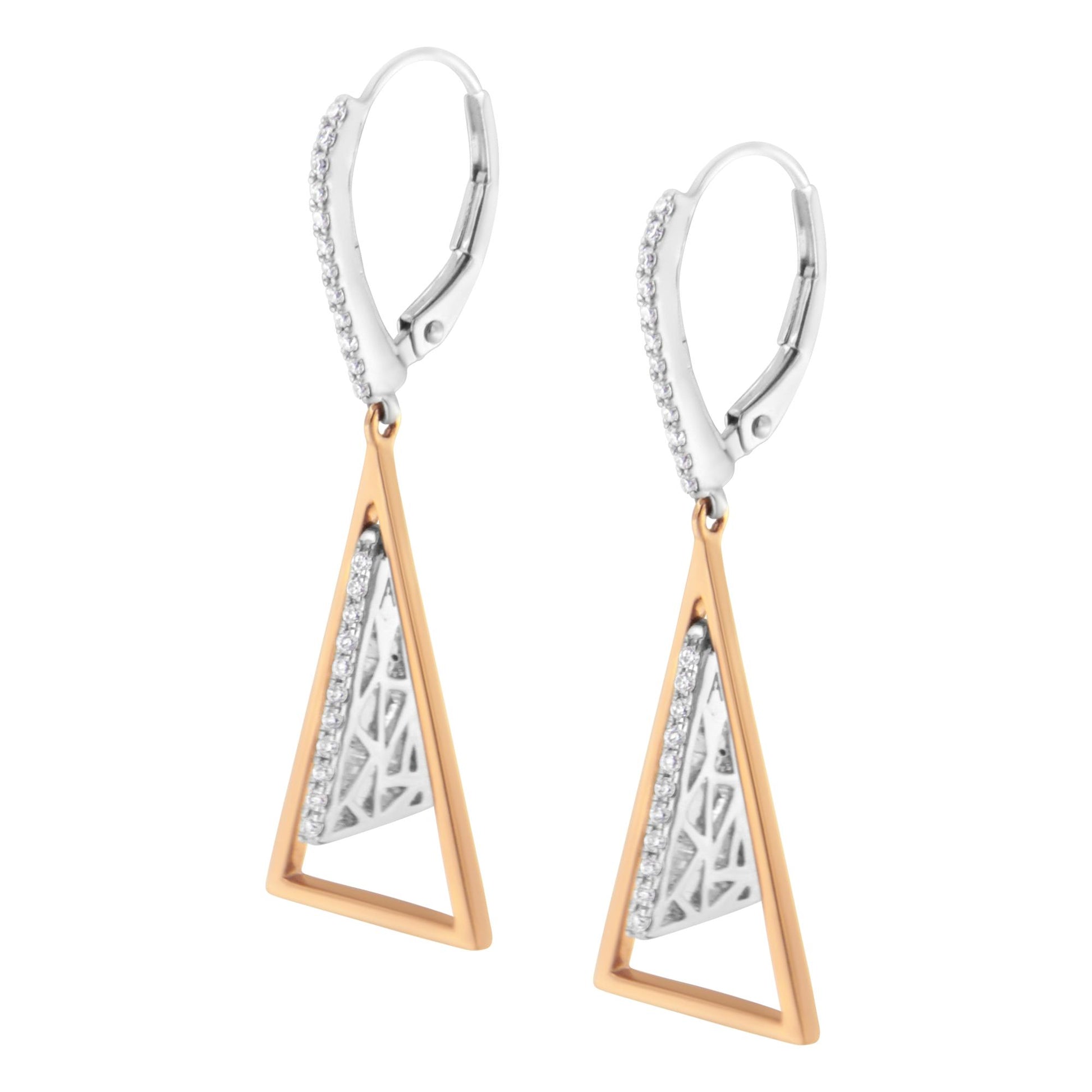 Pair of white and rose metal drop earrings with triangular open frame and inner triangular detail with pave-set white gemstones, shown in close-up front angle.