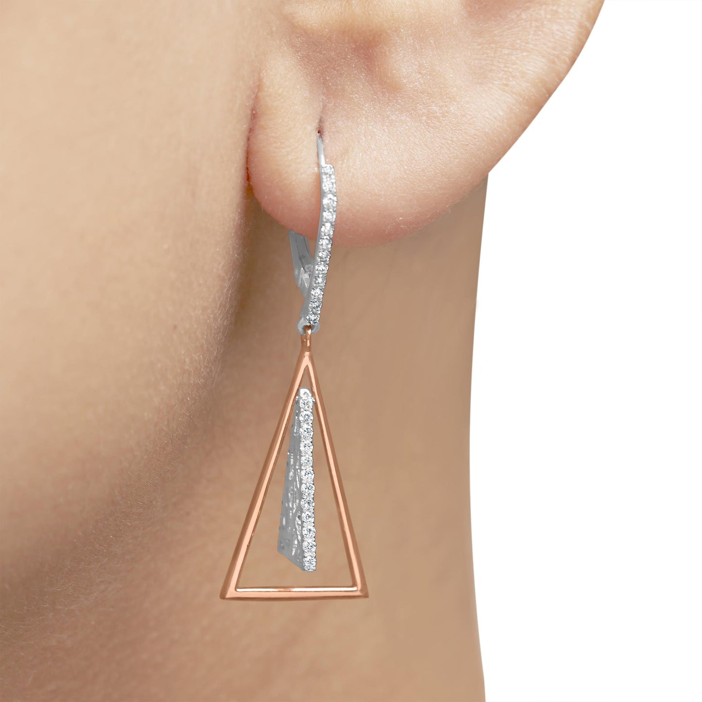 Close-up side view of a two-tone earring on a model's ear with a white metal upper part featuring small white gemstones in pave setting and a rose metal open triangular shape dangling below.