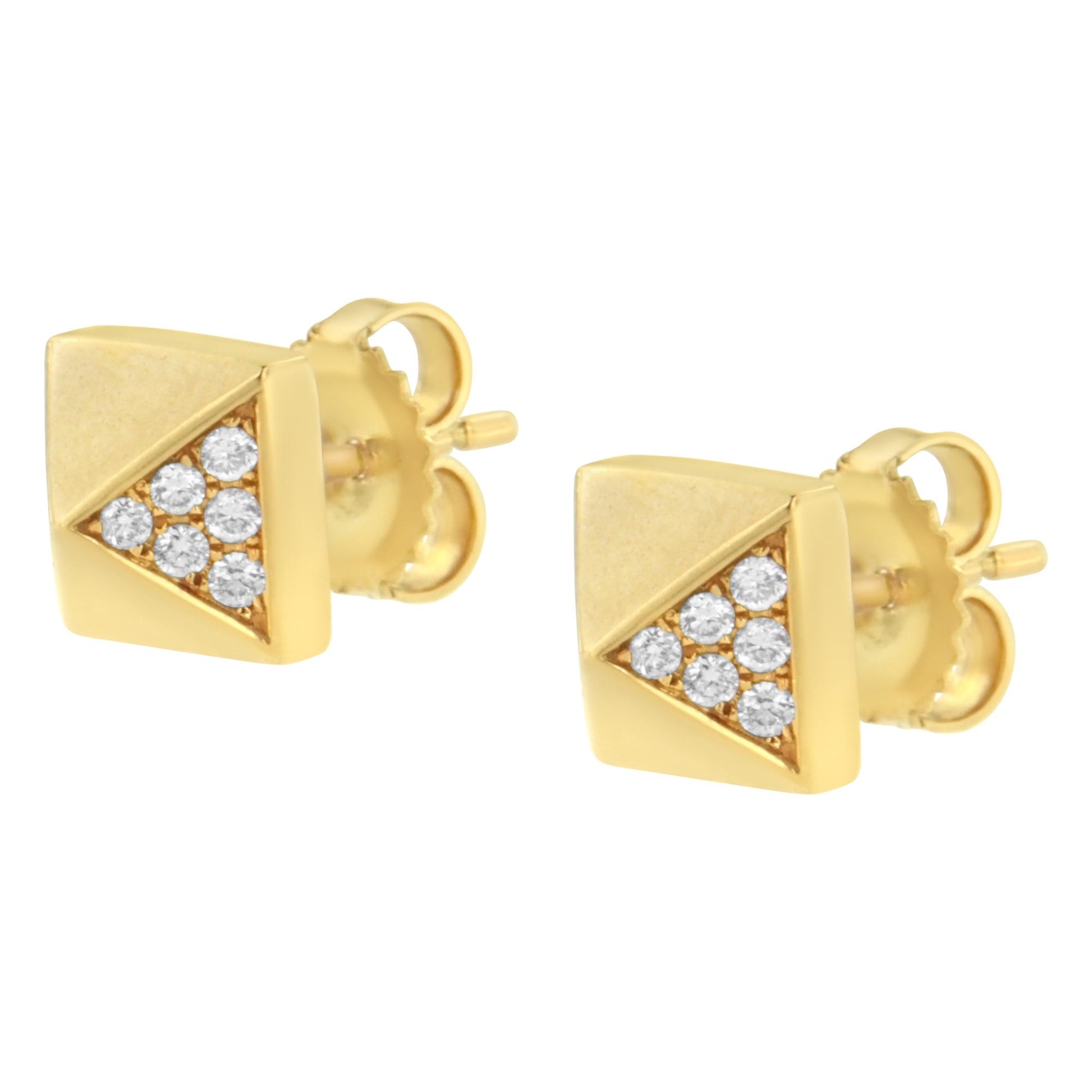 Pair of yellow metal stud earrings with triangular clusters of round white gemstones, shown from a slight side angle.