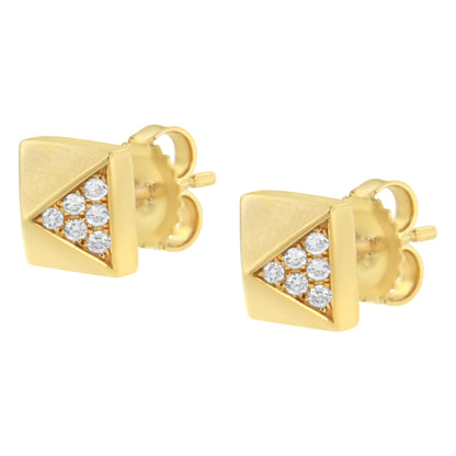 Pair of yellow metal stud earrings with triangular clusters of round white gemstones, shown from a slight side angle.