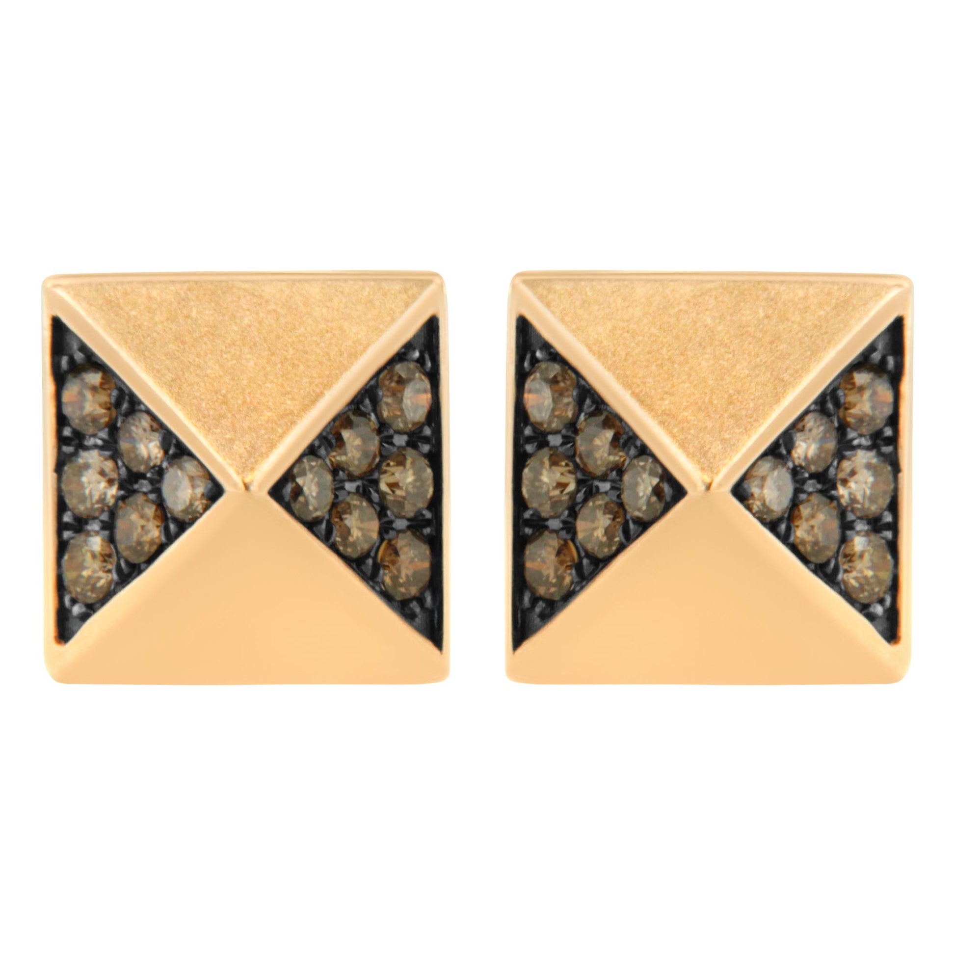 Front angle close-up of a pair of rose metal square stud earrings featuring triangular sections set with round brown gemstones.