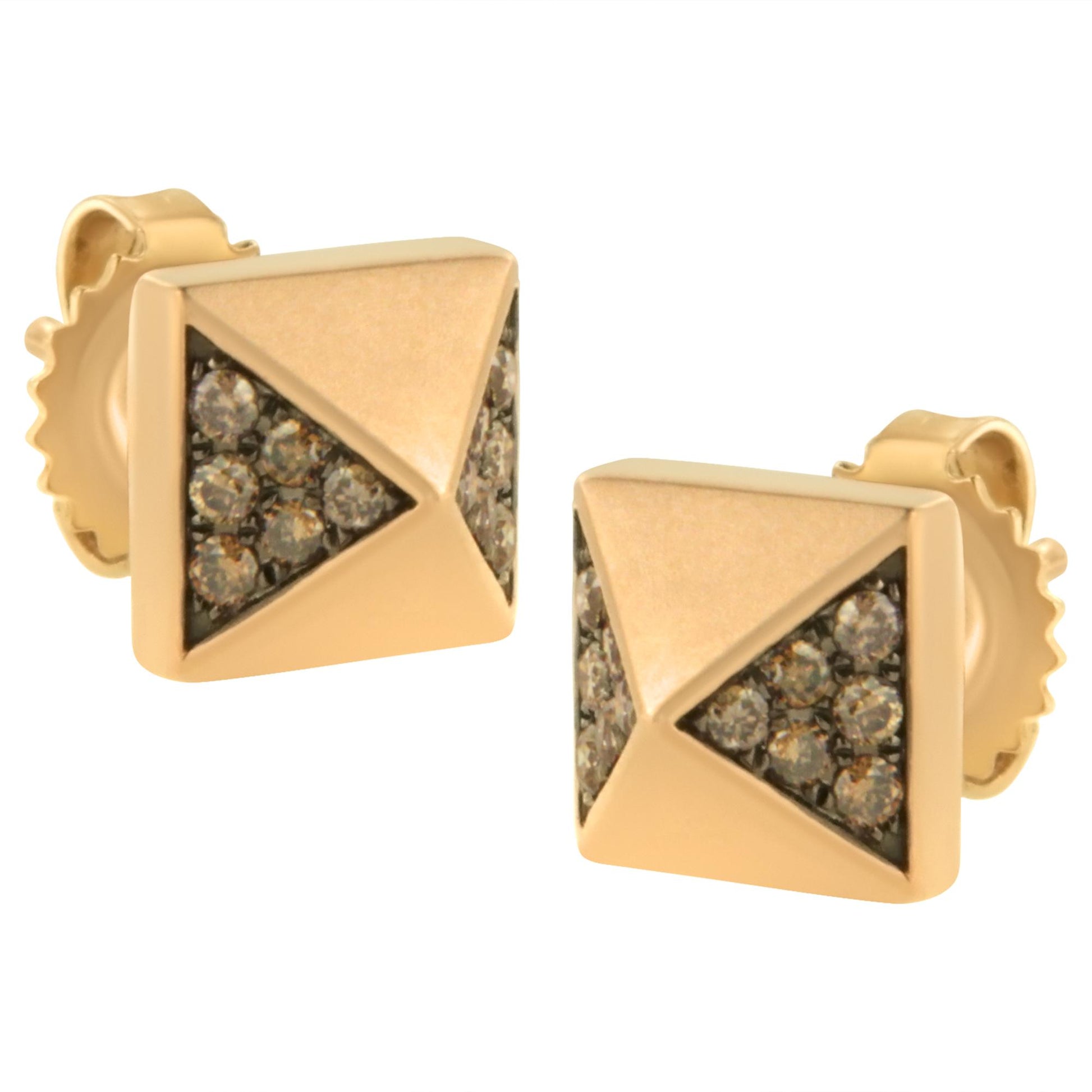 Close-up front angle of rose-colored square stud earrings with triangular sections set with round brown gemstones.