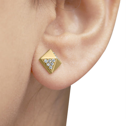 Close-up side view of a yellow metal square-shaped stud earring with round white gemstones set in a triangular pattern, worn on a model's ear.