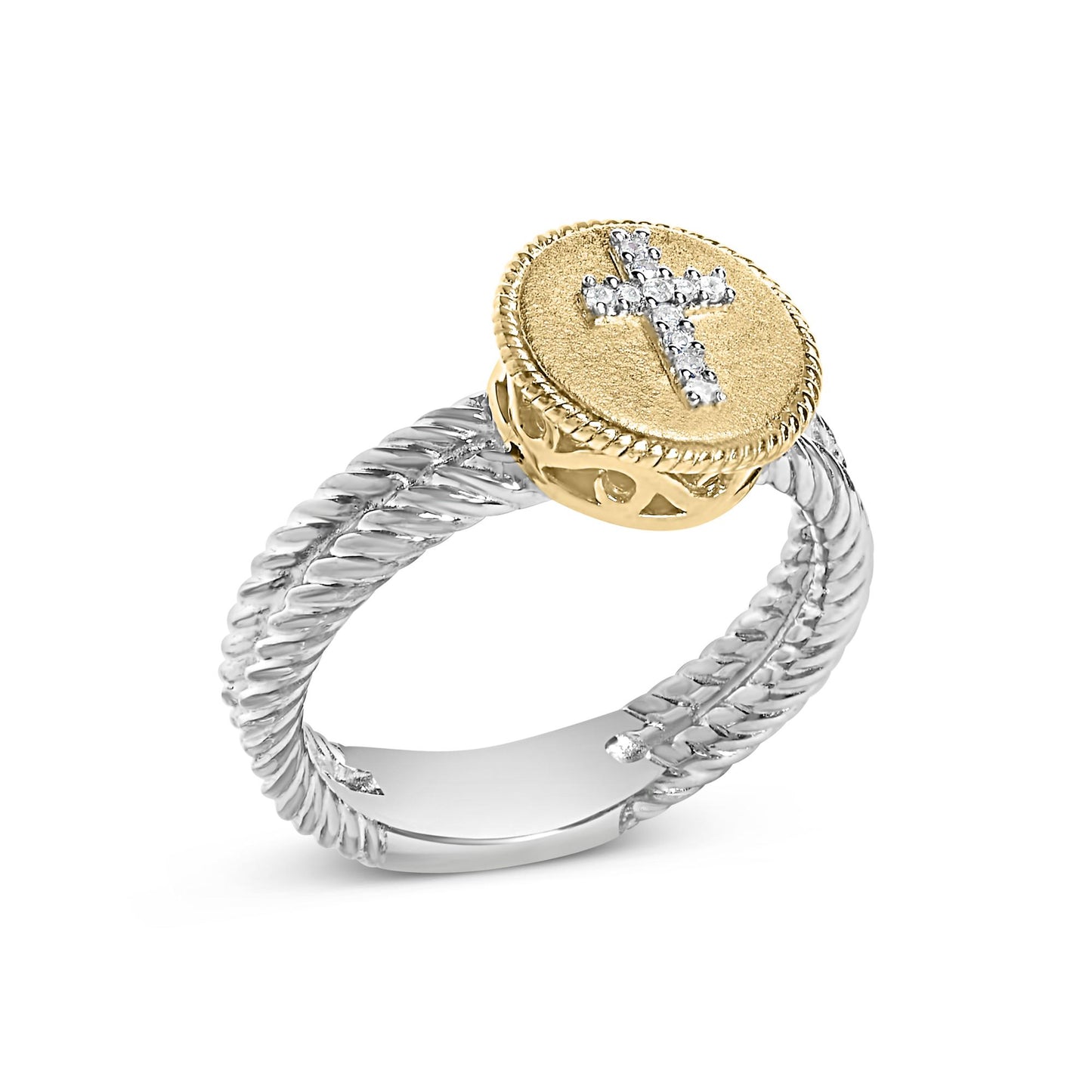 Ring with twisted white metal band and round yellow metal top featuring a cross of white gemstones, shown at slight angle.