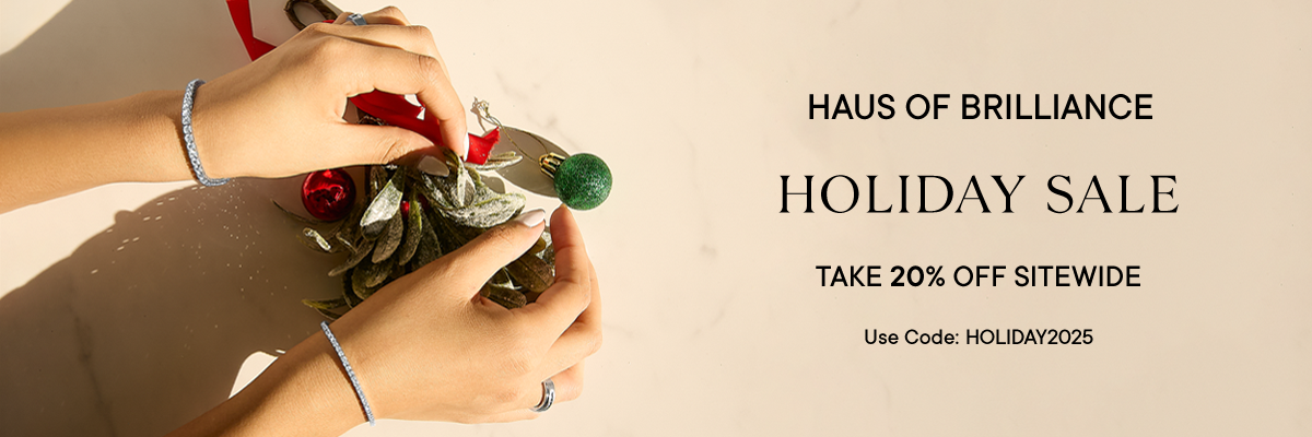 Haus of Brilliance holiday sale banner with hands holding a small Christmas tree decoration.