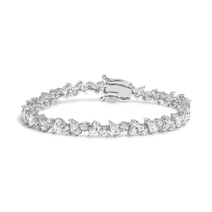 White metal bracelet with alternating pear-shaped and round white gemstones in 3-prong settings, shown from a front angle.