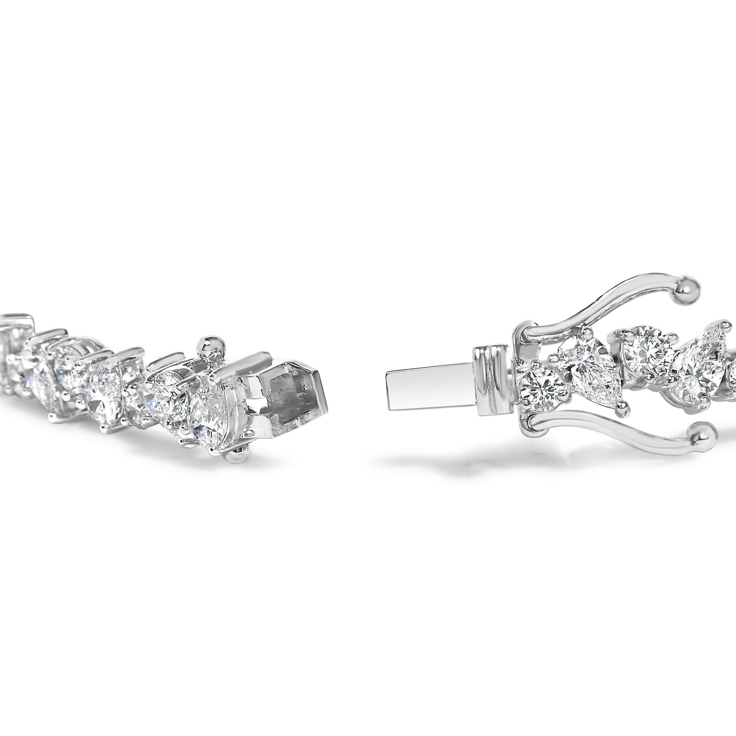 Close-up side angle of a white metal bracelet with alternating pear-shaped and round white gemstones set in three-prong settings, showing the clasp open.