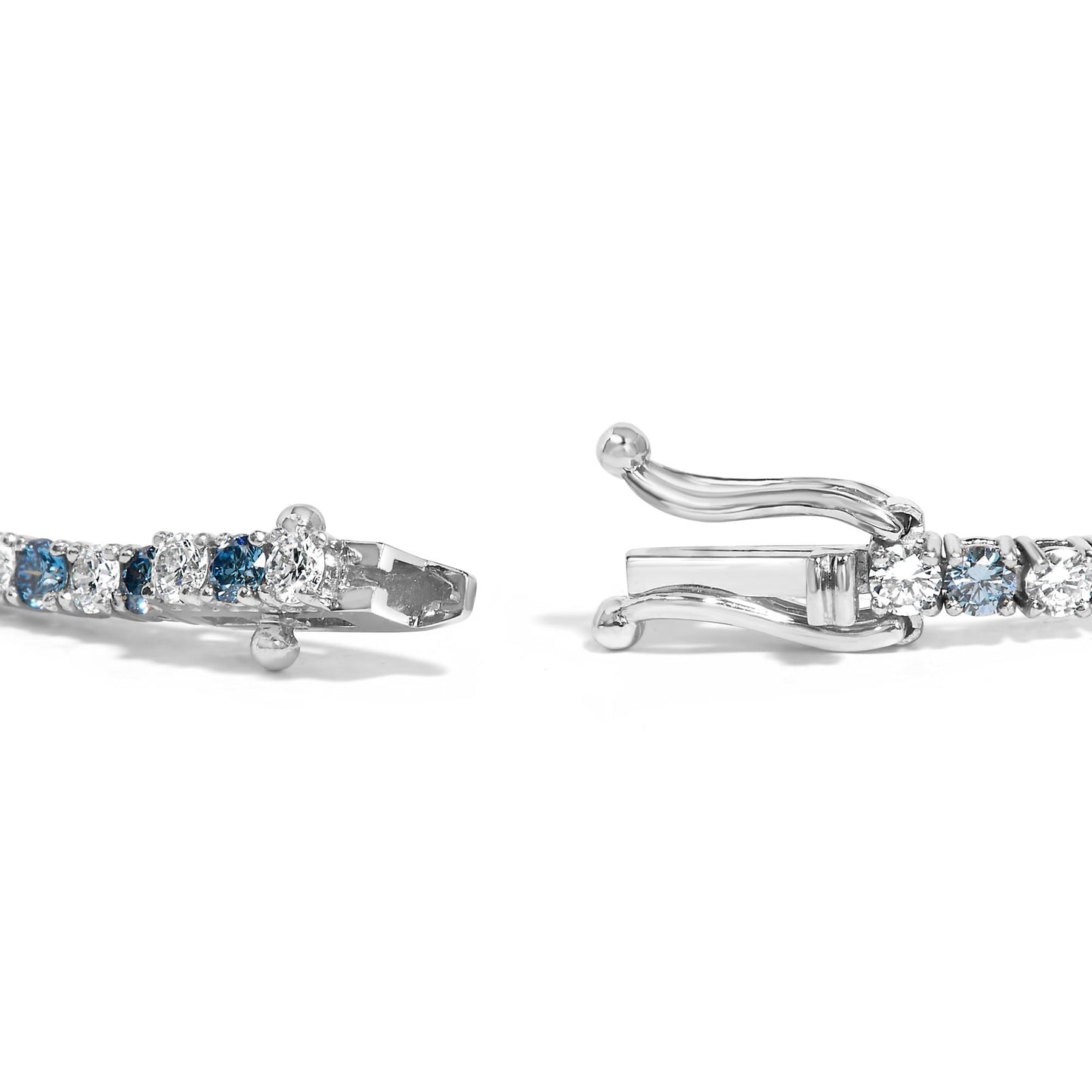 Close-up side angle of a white metal bracelet with alternating round white and blue gemstones in 4-prong settings, showing the open clasp.